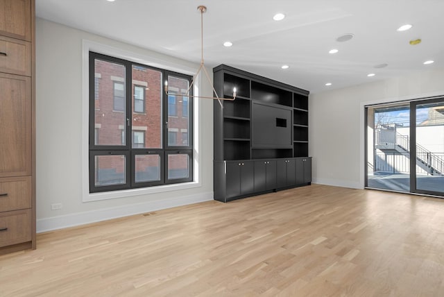 unfurnished living room with recessed lighting, visible vents, baseboards, and light wood-style flooring