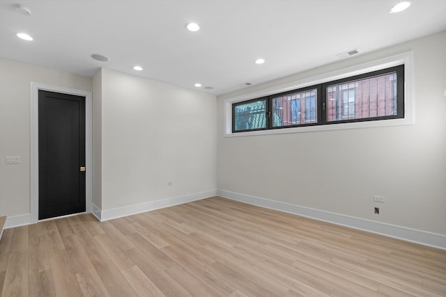 empty room featuring recessed lighting, visible vents, baseboards, and light wood-style floors