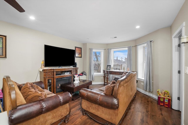 living room with visible vents, recessed lighting, wood finished floors, and baseboards