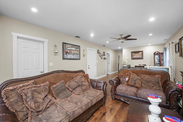 living area featuring visible vents, recessed lighting, a ceiling fan, and wood finished floors