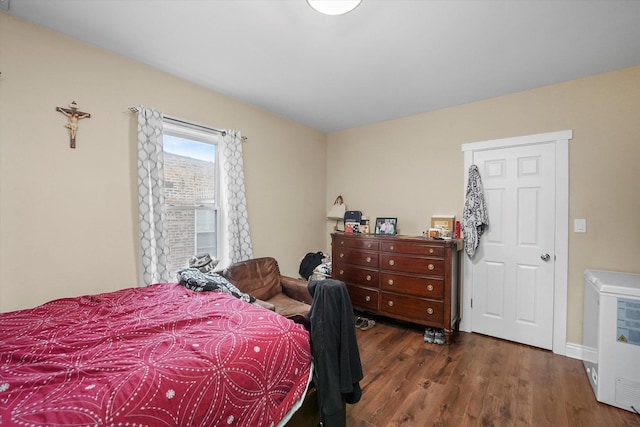 bedroom with wood finished floors