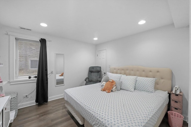 bedroom with recessed lighting, visible vents, baseboards, and dark wood-type flooring