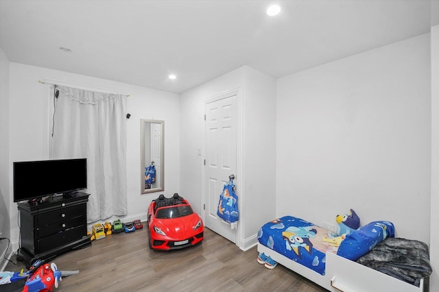 bedroom featuring recessed lighting, baseboards, and wood finished floors