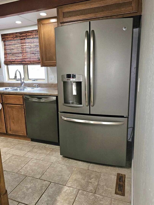 400 S 2nd St, Wapella, IL 61777 - kitchen featuring stainless steel refrigerator with ice dispenser, black dishwasher, a sink, recessed lighting, and brown cabinets