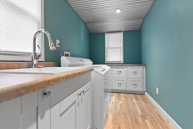 400 S 2nd St, Wapella, IL 61777 - washroom with cabinet space, washer hookup, light wood finished floors, and baseboards