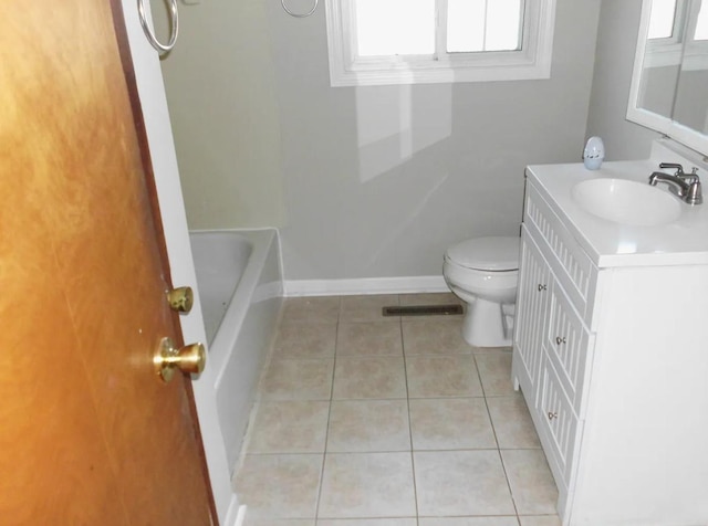 bathroom with visible vents, toilet, tile patterned flooring, baseboards, and vanity