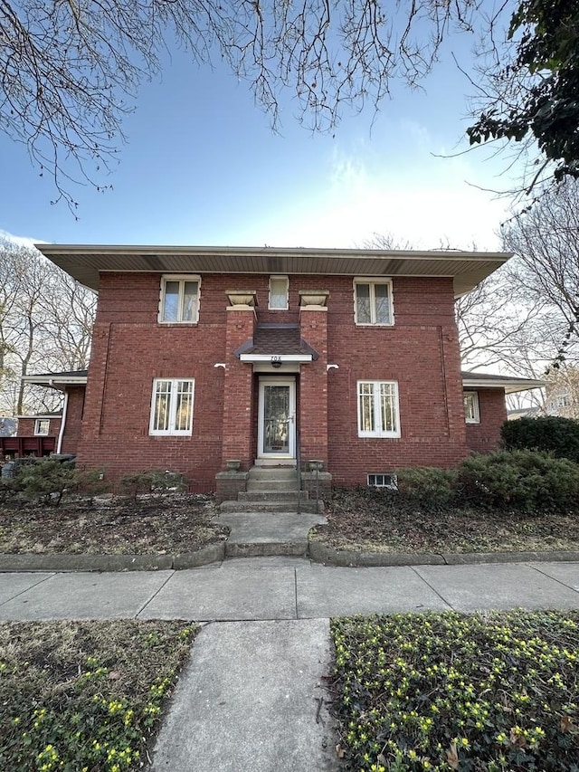 view of front of house featuring brick siding