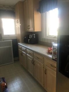 kitchen with light countertops and light floors