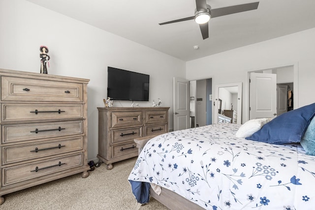 bedroom with light carpet and ceiling fan