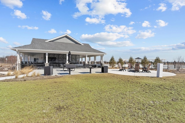 view of property's community with a gazebo, a yard, and fence