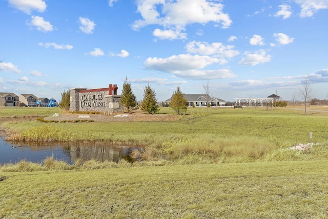 exterior space featuring a yard and a water view