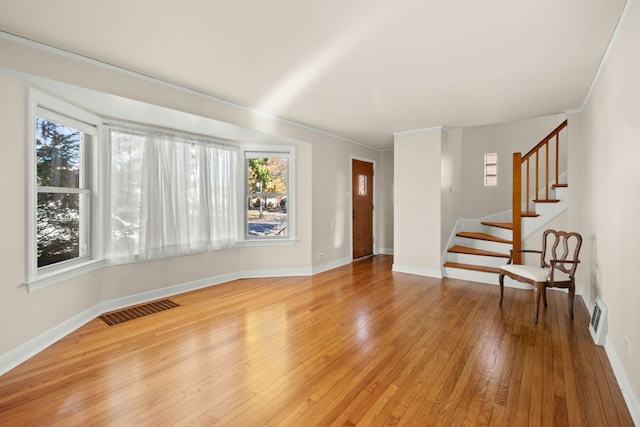 3119 W 83rd St, Chicago, IL 60652 - unfurnished living room with plenty of natural light, light wood-style flooring, stairway, baseboards, and ornamental molding