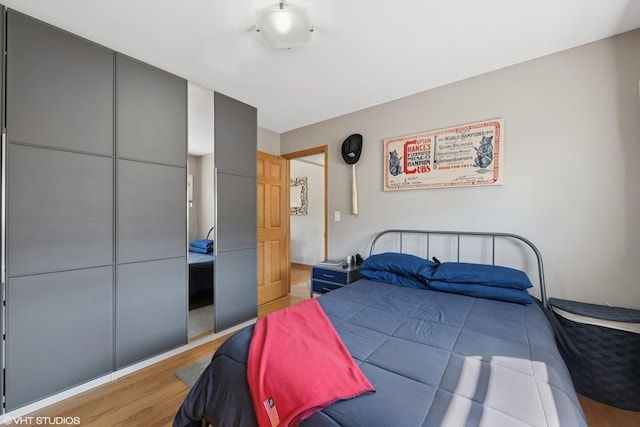 bedroom featuring light wood-style flooring