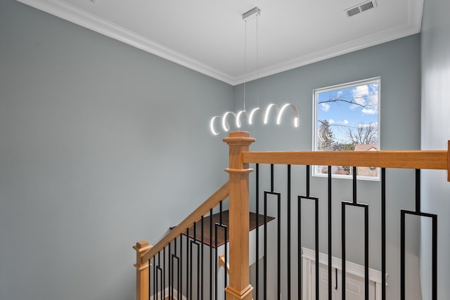 staircase with crown molding and visible vents