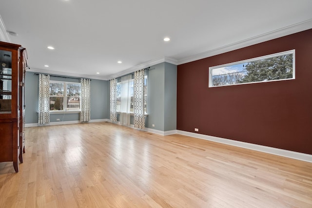 unfurnished living room featuring light wood finished floors, recessed lighting, baseboards, and ornamental molding