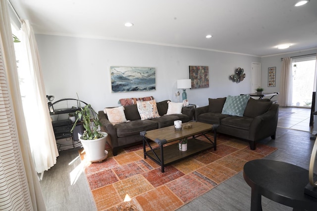 living room with recessed lighting and ornamental molding