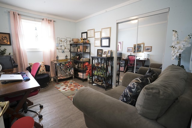 home office with wood finished floors and crown molding