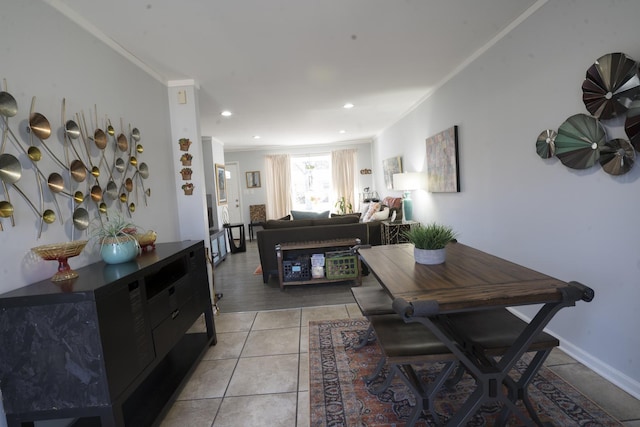 dining space featuring light tile patterned flooring, recessed lighting, crown molding, and baseboards