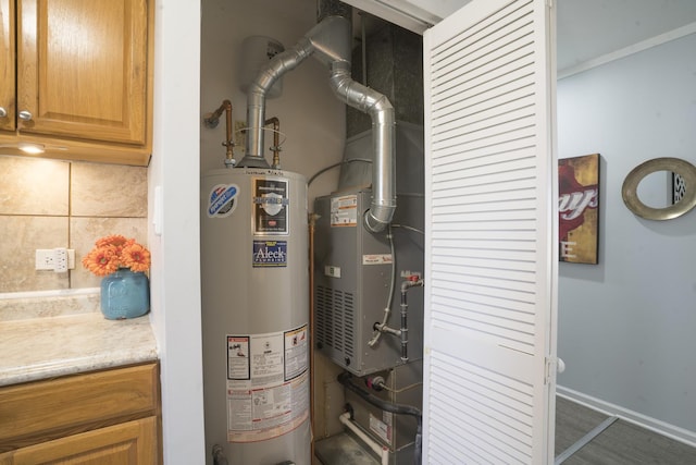 utility room featuring gas water heater