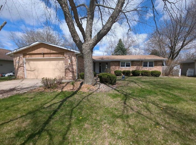 single story home with brick siding, concrete driveway, a front yard, and an attached garage