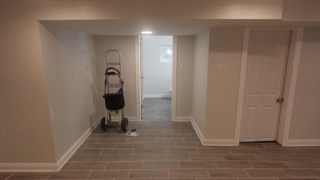 hallway featuring baseboards