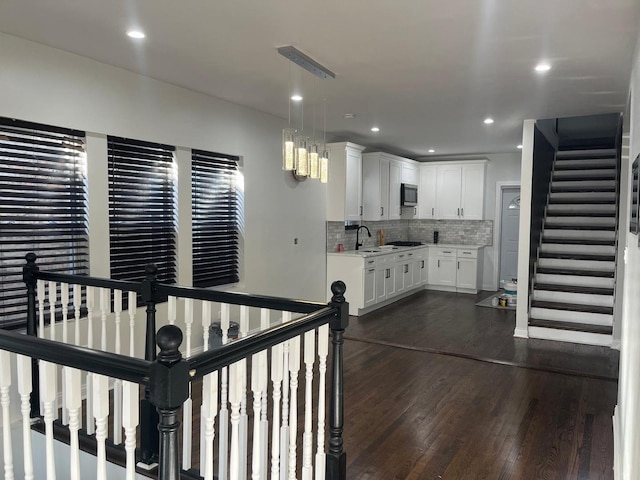 interior space with recessed lighting and wood finished floors