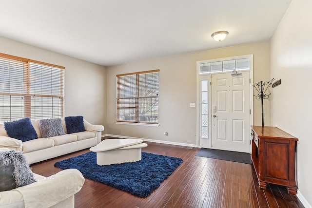 330 Alexis St, Plano, IL 60545 - entrance foyer with dark wood-style flooring and baseboards