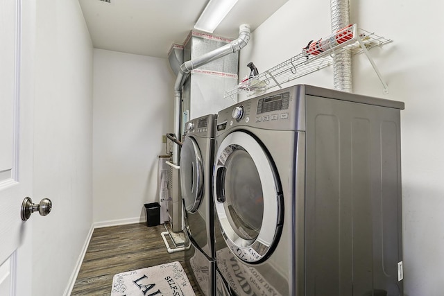 330 Alexis St, Plano, IL 60545 - clothes washing area with dark wood-type flooring, washing machine and dryer, laundry area, and baseboards