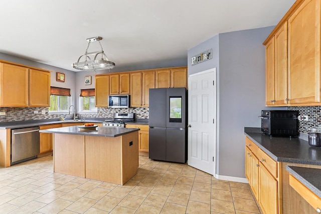 330 Alexis St, Plano, IL 60545 - kitchen with appliances with stainless steel finishes, a center island, dark countertops, decorative backsplash, and a sink