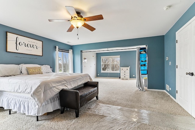 330 Alexis St, Plano, IL 60545 - carpeted bedroom featuring ceiling fan, baseboards, and multiple windows