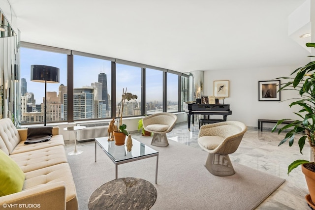 living area with plenty of natural light, a city view, and radiator heating unit