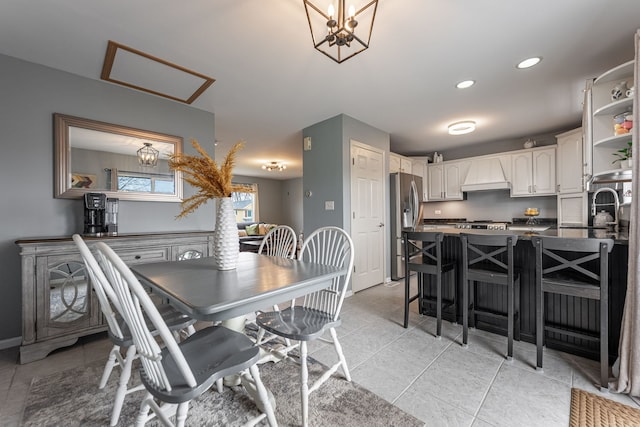 dining room with baseboards, a chandelier, and recessed lighting
