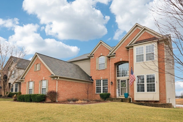 2734 Carrington Dr, West Dundee, IL 60118 - traditional home featuring brick siding, a front lawn, and a shingled roof