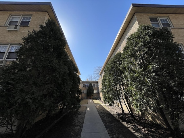 view of side of property featuring brick siding