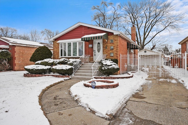 bungalow-style home featuring brick siding, a chimney, a gate, and fence