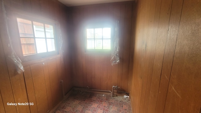 809 W Columbia St, Danville, IL 61832 - interior space with wooden walls and brick floor