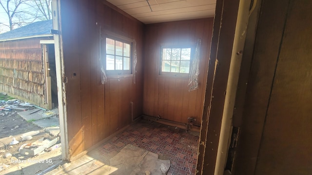 809 W Columbia St, Danville, IL 61832 - entryway with brick patterned floor and wood walls