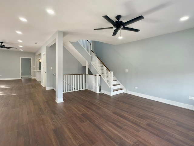 spare room with dark wood finished floors, recessed lighting, a ceiling fan, and baseboards