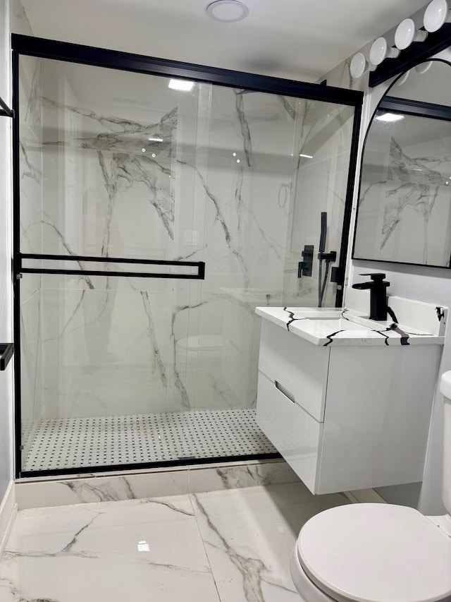 bathroom with a marble finish shower, toilet, marble finish floor, and vanity