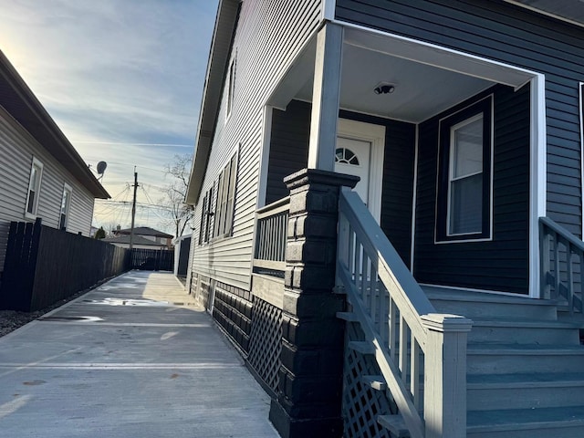 view of exterior entry with fence