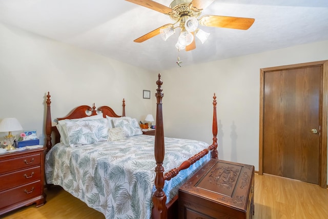 bedroom with light wood-type flooring and a ceiling fan