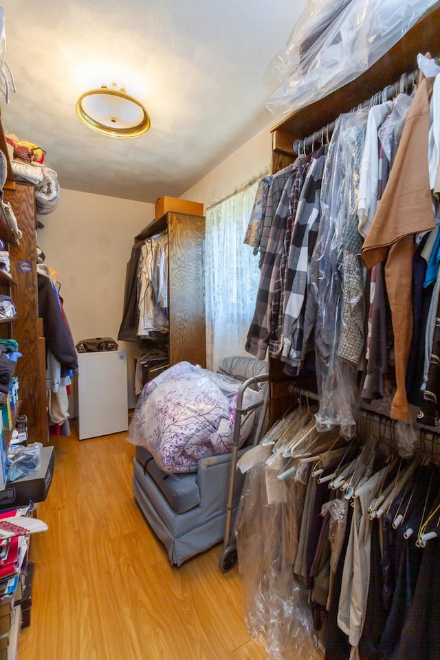spacious closet with wood finished floors