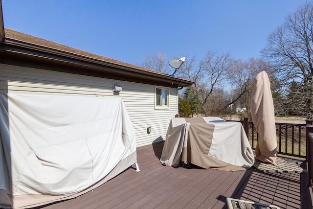wooden terrace featuring area for grilling