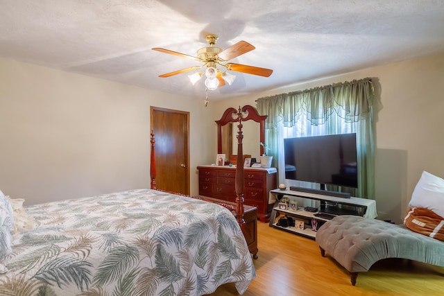 bedroom featuring ceiling fan and wood finished floors