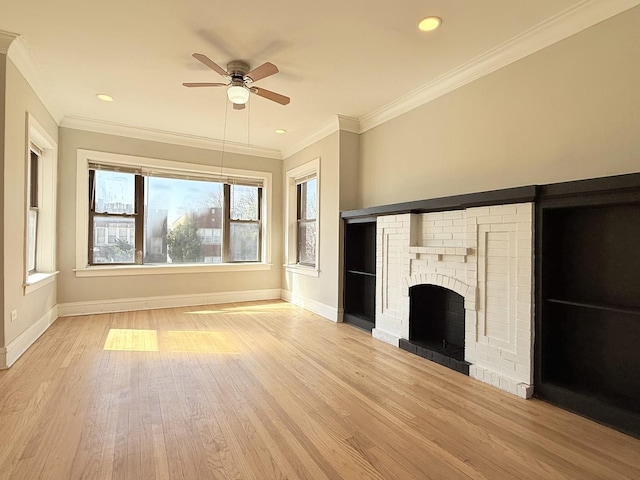 unfurnished living room featuring baseboards, crown molding, ceiling fan, and wood finished floors