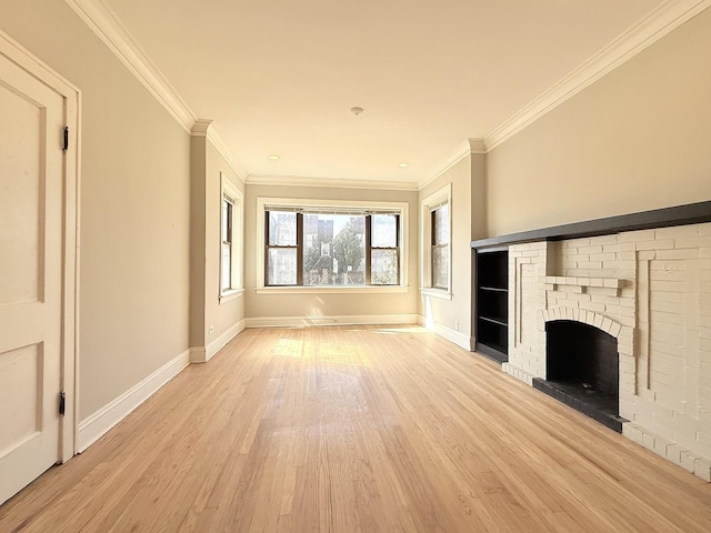 unfurnished living room with crown molding, baseboards, and light wood-type flooring