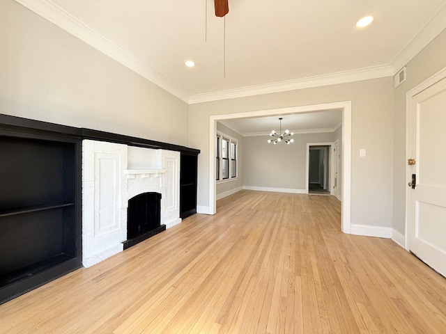 unfurnished living room with visible vents, baseboards, ornamental molding, light wood-style floors, and a brick fireplace