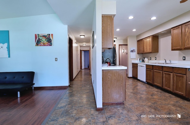 17825 W Cheyenne Ct, Grayslake, IL 60030 - kitchen with dishwasher, a sink, light countertops, brown cabinetry, and baseboards