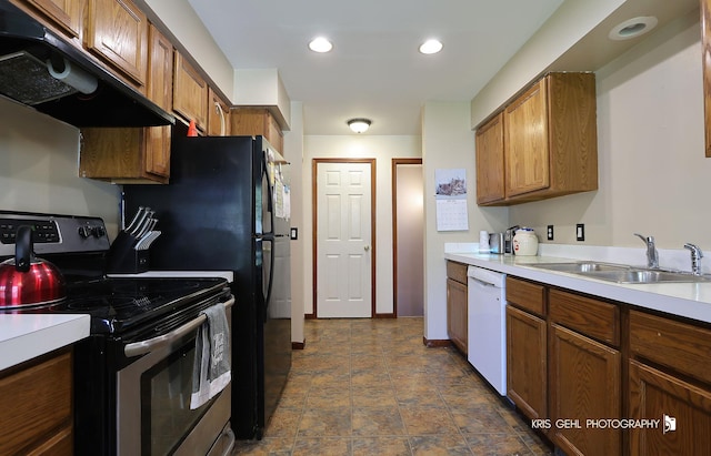 17825 W Cheyenne Ct, Grayslake, IL 60030 - kitchen featuring stainless steel electric stove, a sink, under cabinet range hood, white dishwasher, and brown cabinets