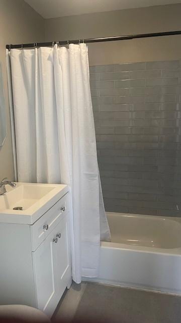 bathroom featuring vanity and shower / bath combo with shower curtain